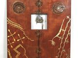 a wooden door that has a clock on it