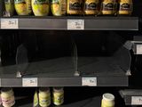 many jars of food on the shelves in the store