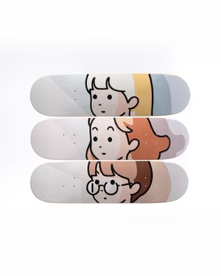 three skateboards with cartoon characters on them stacked on top of each other