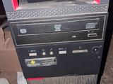 a computer tower with a keyboard and mouse on top of it