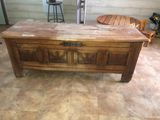 a wooden chest on the floor in a room