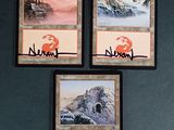 trois cartes sur lesquelles figurent une montagne et un coucher de soleil
