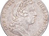 a close up of a coin with a woman ' s head on it