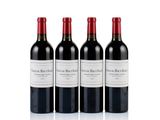 three bottles of red wine sitting next to each other on a white surface
