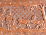 a wooden panel with a picture of a man and a dog on it