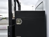 a black truck that is parked in a parking lot
