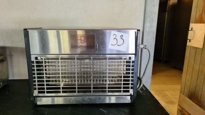 a toaster that is on a counter in a kitchen