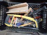 a basket full of tools and a hammer in it
