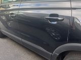 a picture of a car parked on the side of the road