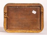 a small wooden box with a tag on it