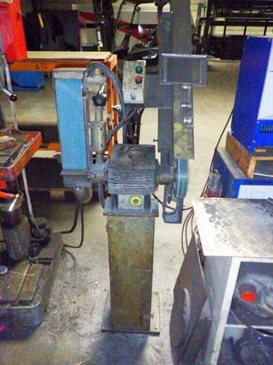 a machine that is sitting in a room with many tools