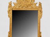 une image d'un miroir avec un cadre doré sur un fond blanc