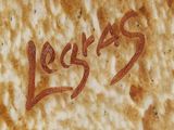 a close up of a piece of bread with the word jesus written on it