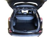 the back of a car with its trunk open showing the cargo compartment