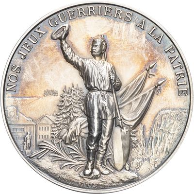 an image of a silver medal with a man holding a flag