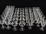 a lot of empty wine glasses on a black table