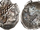 a silver coin with an image of a woman on it