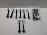 several toothbrushes are lined up in a row on a table