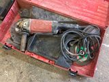 a red box with tools in it on the ground