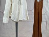 a mannequin and a dress on a stand in a room