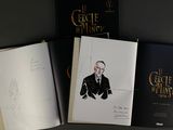 three books with drawings of a man in a suit and tie