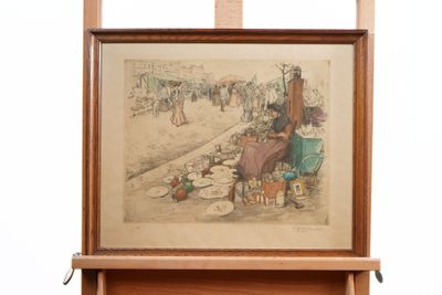 a picture of a painting on a easel that is hanging on a wall