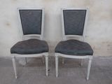 pair of french style dining chairs with black upholstered seats