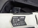 a cordless tool that is sitting on a piece of luggage