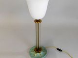 a lamp that is sitting on a table next to a lamp