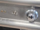 a stove top with a burner on it in a kitchen