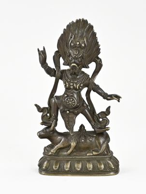 a bronze statue of a woman with a bird on her head