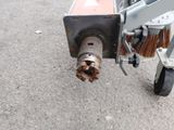 a close up view of a small machine with a brush on it