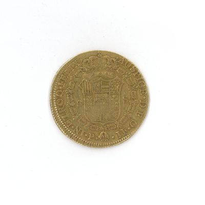 une vieille pièce d'or sur laquelle figure un blason