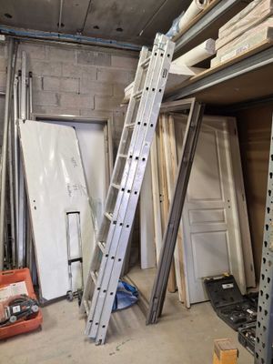 a ladder that is leaning against a wall in a room