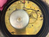 a clock that is sitting in the middle of a hole