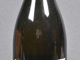 a bottle of wine that is sitting on a table