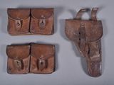 three pieces of leather are shown on a gray surface