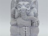statue of an elephant with a human head on a white background