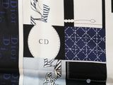 a black and white picture of a bag with a monogram pattern on it