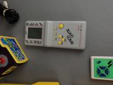 several electronic toys that are sitting on a table