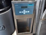 an image of a coffee maker that is on the ground