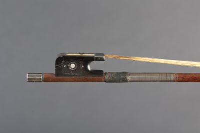 a bow that has a wooden handle on it