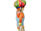 a figurine of a clown with a hat on