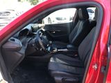 a red car with black seats and a steering wheel