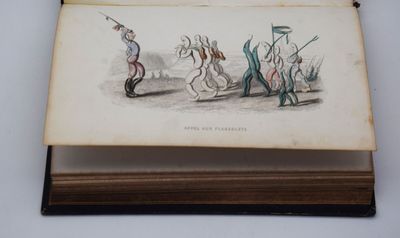 un vieux livre sur lequel est dessiné un groupe de personnes