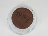 a chocolate cake in a glass bowl on a table