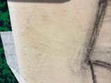 a pencil drawing of a woman ' s face on a piece of paper