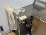 a kitchen with a sink and a dishwasher in it