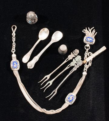 a lot of silver items that are on a black table