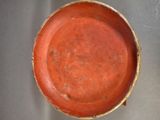 a red bowl that is sitting on a table